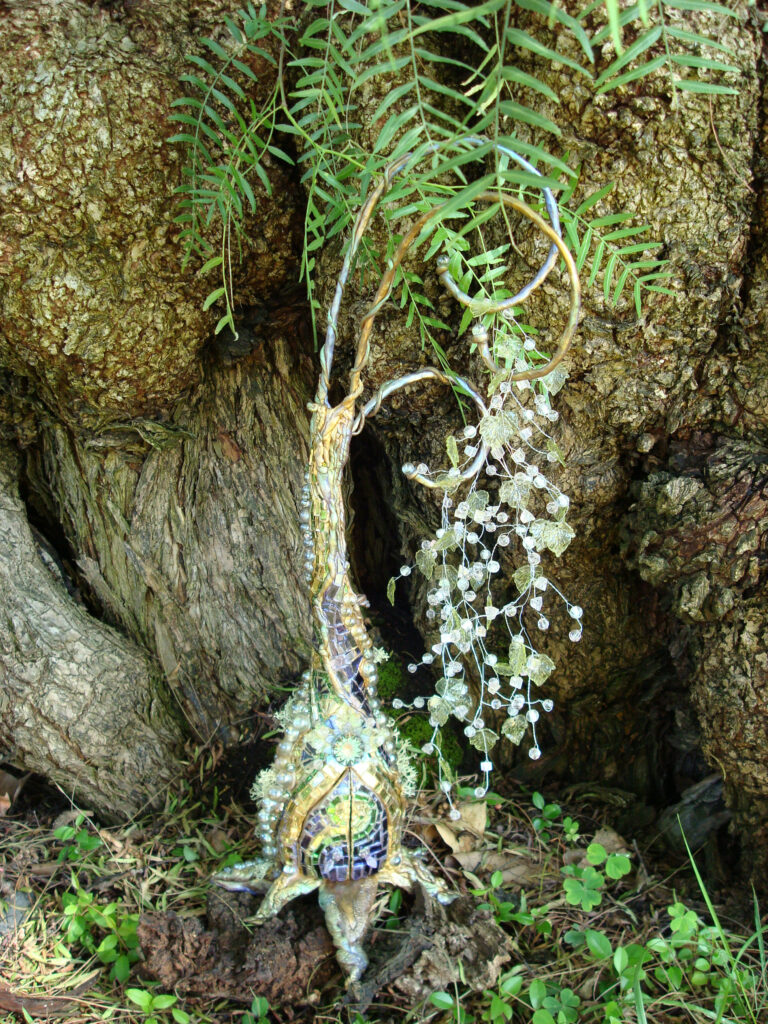 A tree with a bunch of plants hanging from it