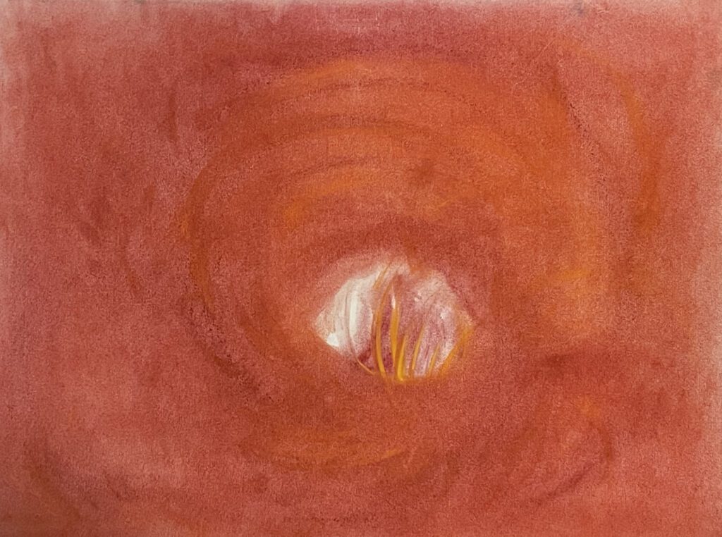 A close up of an orange and white painting